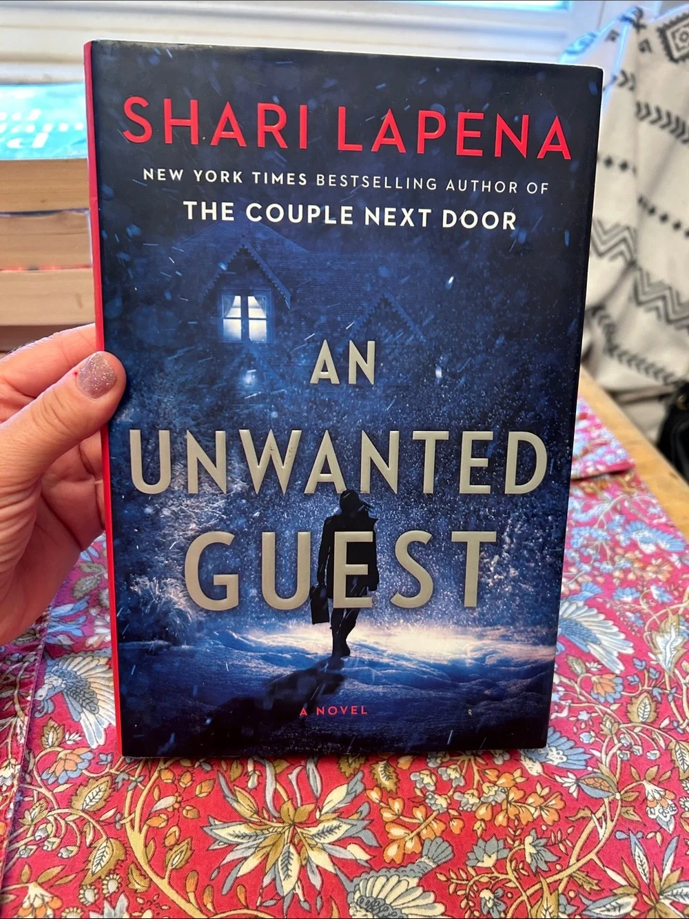 An Unwanted Guest by Shari Lapena Blue Hardcover Novel